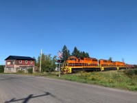 Featuring a level of horsepower rarely seen on the Huron Central, SUSM (Sudbury - Sault Ste. Marie) features a lash up of 9000 total horsepower from its sister roads. With a train made up of empty coil cars, bulkhead flats, a few gasoline tankers and boxcars, the train coasts across the Gordon Lake Rd. crossing due to a slow order. This train will soon finish the last leg of its trip, before quickly flipping around with a fresh crew, hauling loaded coils, plate steel and calcium carbonate cars east to Sudbury, needing all 9000 horses the lineup can provide. 