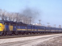 VIA 6777 and her train are in Scarborough, Ontario on March 23, 1982.