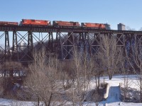 <br>
<br>
Westbound approach Leaside, 
<br>
<br>
CP Rail 4502 /  4712 /  4503; a MLW trio:  M630 / M636 / M630
<br>
<br>
at Eglinton & Leslie, Leaside, February 22, 1981 Kodachrome by S.Danko
<br>
<br>
The Park:  E T Seton Park;
<br>
<br>
The Bridges: two bridges: north bridge (train is on) built by Canadian Northern Railway - to access CNoR shops in Leaside (CN Leaside);
<br>
<br>
 south bridge (original) bridge built by the Ontario & Quebec Railway
<br>
<br>
note location is approx CP Rail mile 205 Belleville Sub ( at mile 204.6 CP Rail Donlands, Junction with CNR Leaside branch) 
<br>
<br>
sdfourty
<br>
<br>
More: 
<br>
<br>
     <a href="http://www.railpictures.ca/?attachment_id=  45018 ">  the CNoR bridge  </a>
<br>
<br><br>
<br>
sdfourty