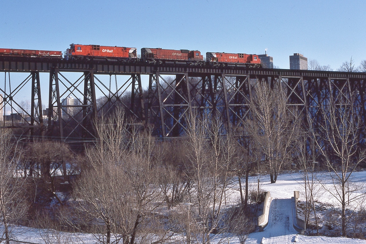 Westbound approach Leaside, 


CP Rail 4502 /  4712 /  4503; a MLW trio:  M630 / M636 / M630


at Eglinton & Leslie, Leaside, February 22, 1981 Kodachrome by S.Danko


The Park:  E T Seton Park;


The Bridges: two bridges: north bridge (train is on) built by Canadian Northern Railway - to access CNoR shops in Leaside (CN Leaside);


 south bridge (original) bridge built by the Ontario & Quebec Railway


note location is approx CP Rail mile 205 Belleville Sub ( at mile 204.6 CP Rail Donlands, Junction with CNR Leaside branch) 


sdfourty


More: 


       the CNoR bridge  



sdfourty