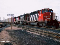 CN train 380 is viewed paused for its crew change across from the CN office building at London East on the Dundas Subdivision. Powering the Windsor-Toronto train is SD40-2(W) 5298, HR616 2108 and GP40-2(W) 9668. CN 2108 was retired on February 13, 1998 and was part of a group of retired HR616’s later sold to National Railway Equipment during June 1998. 

