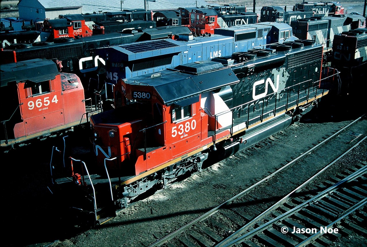 CN SD40-2 5380 is seen on Christmas Day 1994 at MacMillan Yard in Vaughan, only a couple weeks removed from being released from the AMF facility in Montreal, Quebec. The former Union Pacific unit was given upgrades, new paint as well as dynamic brakes prior to entering service on December 9, 1994. The unit was ex-CN 6099, nee-UP 4099.