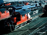 CN SD40-2 5380 is seen on Christmas Day 1994 at MacMillan Yard in Vaughan, only a couple weeks removed from being released from the AMF facility in Montreal, Quebec. The former Union Pacific unit was given upgrades, new paint as well as dynamic brakes prior to entering service on December 9, 1994. The unit was ex-CN 6099, nee-UP 4099.