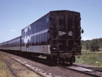 CN 9500 wears the markers for Canadian National Train #3, the Super Continental, at Maple, Ontario on Saturday July 3, 1974.