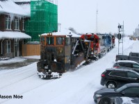 On February 18, CN L540 was sent from Kitchener westbound to Stratford to plow the Guelph Subdivision towards London ahead of that night’s 87. Upon arrival in Stratford, CN L540 lifted Jordan Spreader # 50948 and track department crews prepared it for it’s run west. The power for L540 was 4725, 4910 and 7512. Later, in the afternoon, CN L568 would arrive in Stratford from Kitchener light power and the crews would swap power. 
<br>
Here CN L568 is pictured finally departing Stratford passing the station as they begin spreading westward. Reportedly, they made it to a point west of St. Marys before returning east to Stratford later that evening, with that night’s VIA Rail 87 also being cancelled as well.


