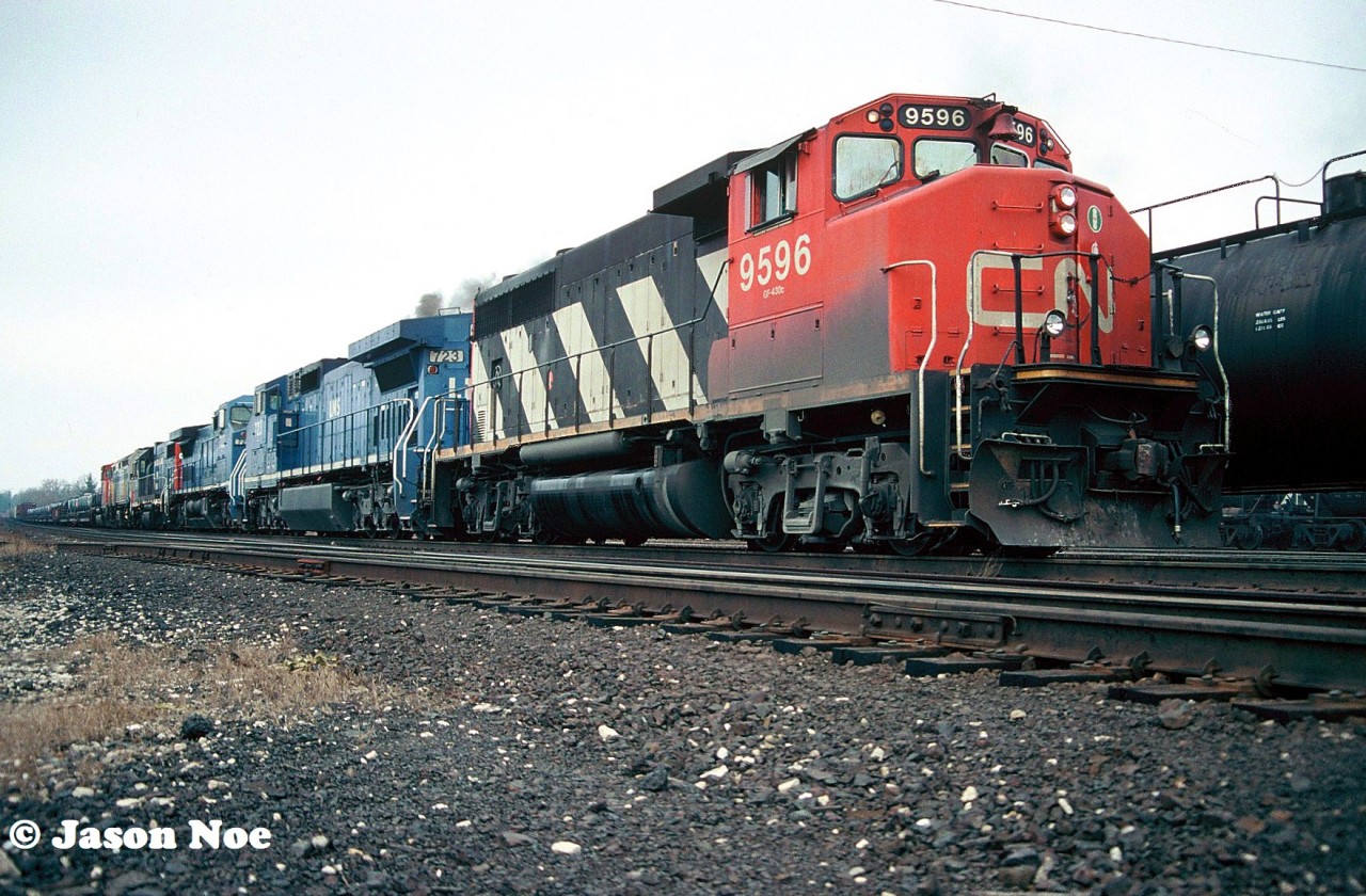 The power for CN 410 has just returned to it’s train on the Dundas Subdivision after working the Brantford, Ontario yard. It’s consist was quite wild and included; CN 9596, LMS 723, LMS 722, GTW 6216, VIA Rail 6419 and CN 9431. Soon it will depart and continue its journey eastward where A.W. Mooney would photograph it that day as well just east of Bayview Jct on the Oakville Subdivision.

The link for his photo;

https://www.railpictures.ca/?attachment_id=8494