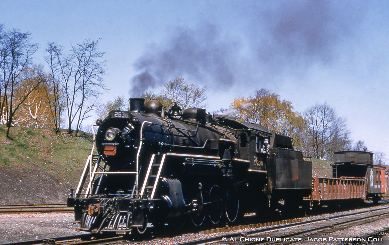 A CNR 2-8-0 heads west towards Hamilton along the Oakville Sub at Bayview with a short train.

Original Photographer Unknown, Al Chione Duplicate, Jacob Patterson Collection Slide.