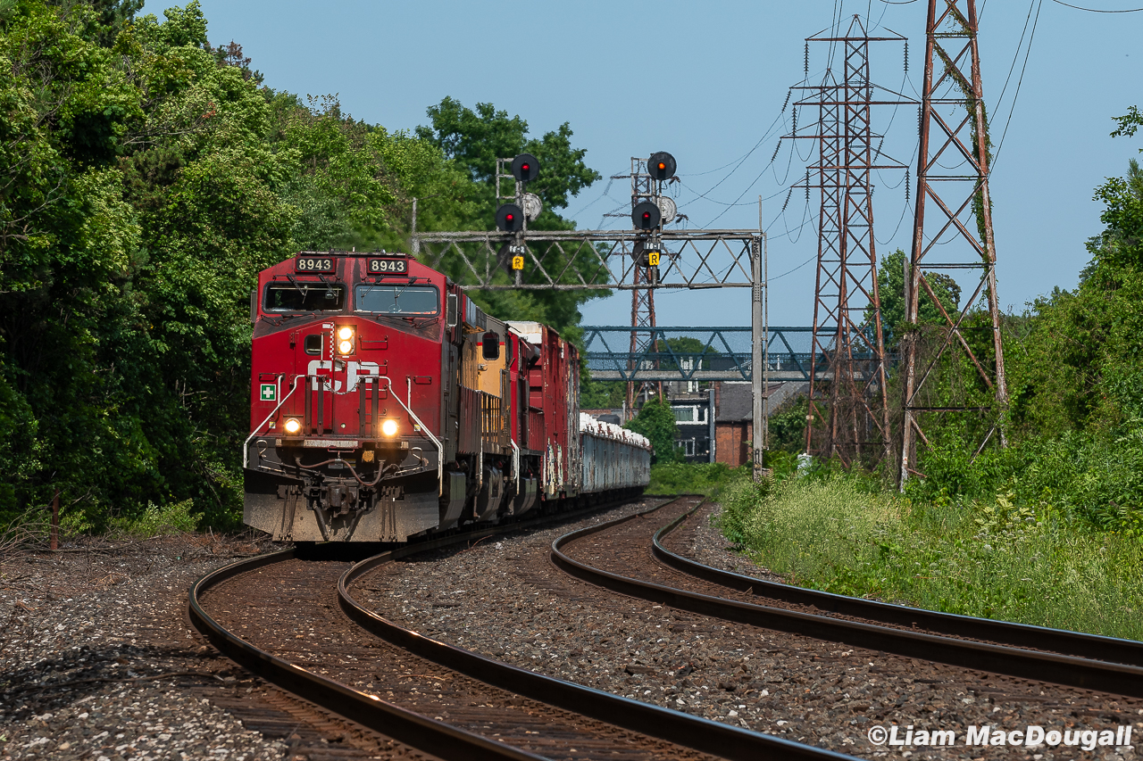 An incredible image taken in 1979 by John Freyseng inspired me to reach into my own archive and pull up this image from only a couple years ago, taken in the exact same spot. Above, CP 421 has a trio of engines up front as it heads west through Rosedale/Summerhill on a nice July afternoon. 

Aside from the signals being changed from an interlocking to a pair of intermediates in the early 80s as well as the service track on the south side being removed, the location hasn't changed all that much in the 40+ years that separates the two images. Unfortunately, fast forwarding to the present day will open up a big change, as in April 2024 the signal bridge (along with every other searchlight on the North Toronto) was torn down. I'm glad to have documented it while I had time, and very grateful for those who were doing it in the decades before me.