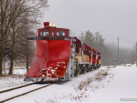 A set of four units tows OSR's plow into Ingersoll en route back to the Salford Shop.  This scene is actually the CAMI Job (1210, 1244, 1245) towing the plow extra (182), which had run into electrical issues a few times during the run to St. Thomas (city limits).  Dying about a mile west of CAMI, the set of pups came to tow the plow back to the shop.

<br><br>CAMI Job?  While CAMI has not required a dedicated job for a few years, one was run to move a large number of cars between the CAMI yard, used for any traffic at the moment, and CN Beachville.  The Woodstock also was assigned three units (8235, 1620, 1594), and two for the St. Thomas (1591, 102), which met the plow at Belmont.