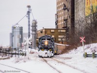 One of GIO's two Welland jobs is seen spotting cars for London Agricultural Services at the old Robin Hood elevator in Port Colborne.  <br><br>Usually paired with <a href=https://www.railpictures.ca/?attachment_id=54349>slug LDSX 269,</a> 7224 was running solo after the slug was found to be having issues.  1859 would briefly take the slug to allow 7224 out of Feeder.  Only two customers would be serviced this day, with this crew spending over 6 hours shuffling cars in and out of the elevator, while 1859 spent the day working Verbio.