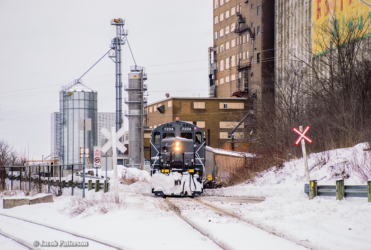 One of GIO's two Welland jobs is seen spotting cars for London Agricultural Services at the old Robin Hood elevator in Port Colborne.  Usually paired with slug LDSX 269, 7224 was running solo after the slug was found to be having issues.  1859 would briefly take the slug to allow 7224 out of Feeder.  Only two customers would be serviced this day, with this crew spending over 6 hours shuffling cars in and out of the elevator, while 1859 spent the day working Verbio.