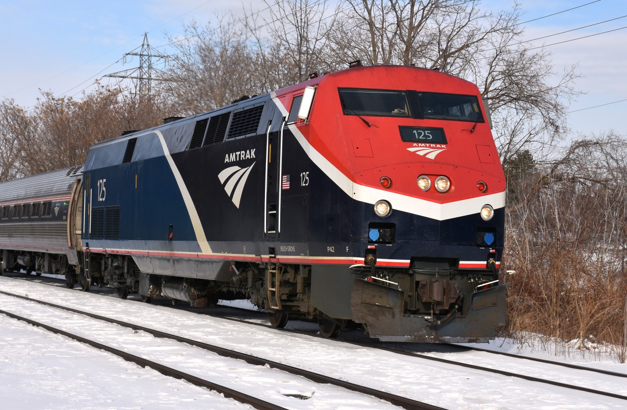 Really refreshing to see the new colourful AMTK Phase VII paint on the morning Amtrak thru town. This #125 has been thru a couple of times in the past week and I finally some decent weather to shoot it in. It certainly looks sharp, and shows what a cosmetic makeover can do for an image.
(Thanks to Terry O'Shell for the heads-up)