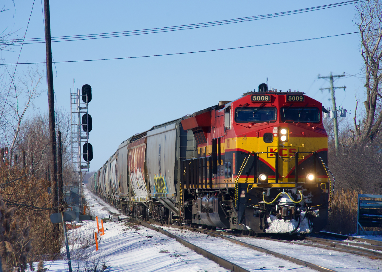 Grain train CPKC 328 is crossing over at Dorval. It is bound for Albany.