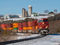 A good ol' candy apple red AC44 on a gorgeous sunny day leading east on the Belleville? I'll chase that any day. CP 9772 East is in charge of train 118 as it rips into the curve approaching Lovekin where they'll meet a westbound empty grainer taking the siding for them. The leader here has seen better days for sure, but the red paint is holding through quite nicely after over 20 years in service. 