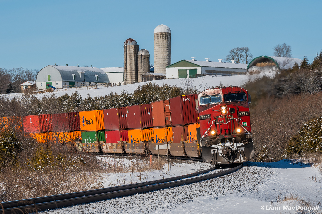 A good ol' candy apple red AC44 on a gorgeous sunny day leading east on the Belleville? I'll chase that any day. CP 9772 East is in charge of train 118 as it rips into the curve approaching Lovekin where they'll meet a westbound empty grainer taking the siding for them. The leader here has seen better days for sure, but the red paint is holding through quite nicely after over 20 years in service.