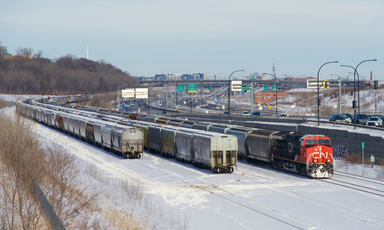 CN 875 has just arrived at Turcot Ouest, where it will get recrewed and refueled before continuing west with grain empties. More grain cars are parked on Track 29 and the Freight Track.