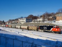 Rebuilt CN 8314 leads grain train CN 874. It is about to tie down and refuel before getting a new crew to take it further east.