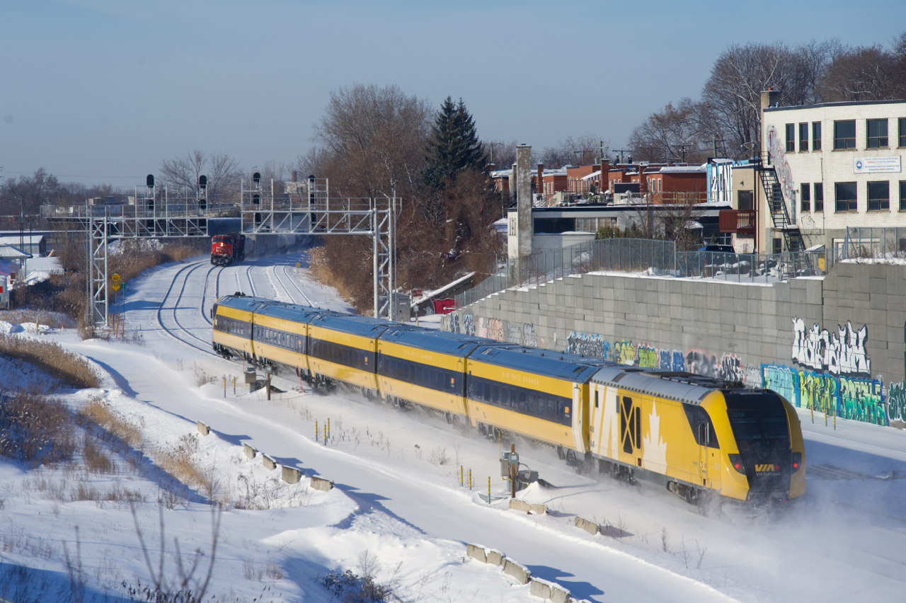 VIA 633 has the Lumi consist as it heads west. CN 324 is approaching at left.