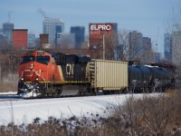 A slightly late CN 305 passes the skyline of downtown Montreal.