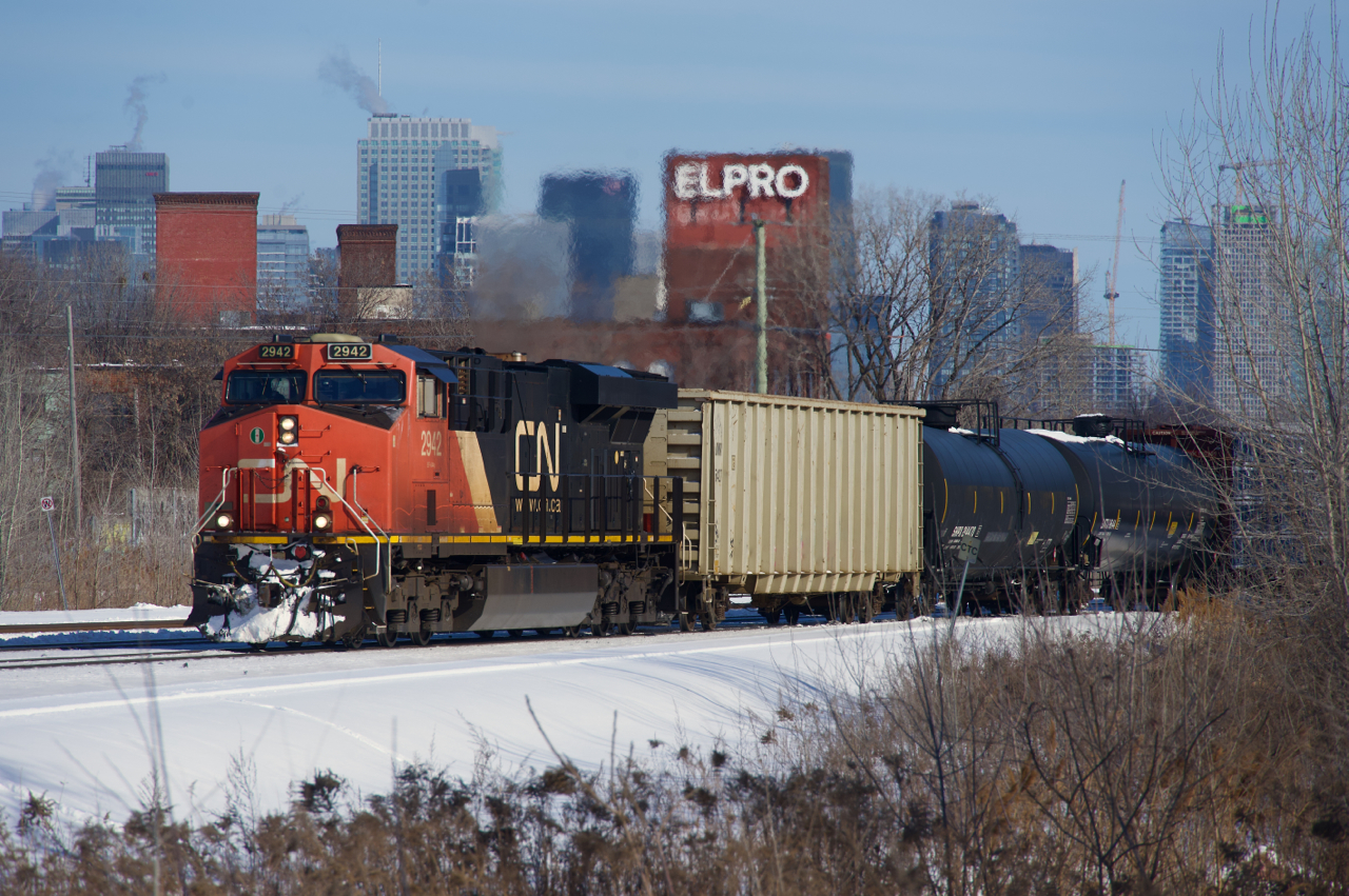 A slightly late CN 305 passes the skyline of downtown Montreal.