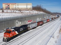 Fresh rebuild CN 3368 brings up the rear of grain train CN 874. It is about to tie down on the Freight Track.