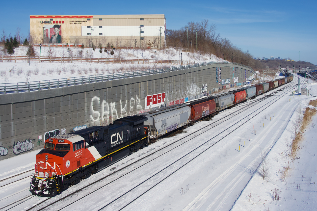 Fresh rebuild CN 3368 brings up the rear of grain train CN 874. It is about to tie down on the Freight Track.