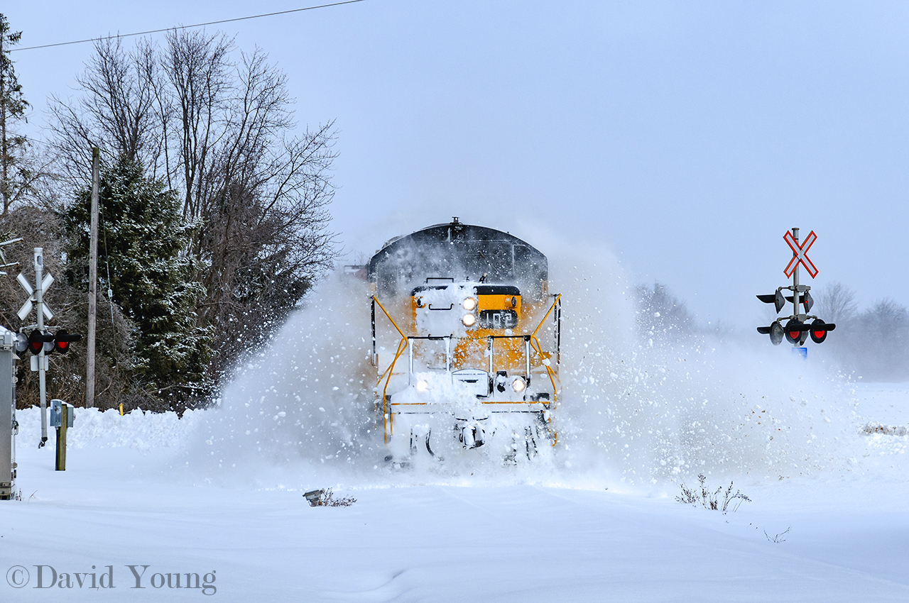 Blowing up the windrow's, St. Thomas bound after a snow storm.