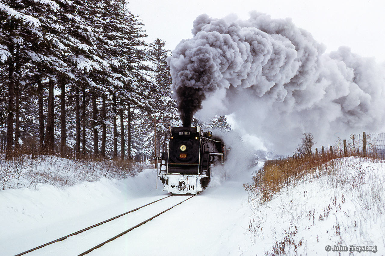 Headed west out of Caledonia, CNR 6218 and its excursion approach the crossing at Onondaga Townline Road with a Toronto - Paris UCRS excursion.



Scan and editing by Jacob Patterson.