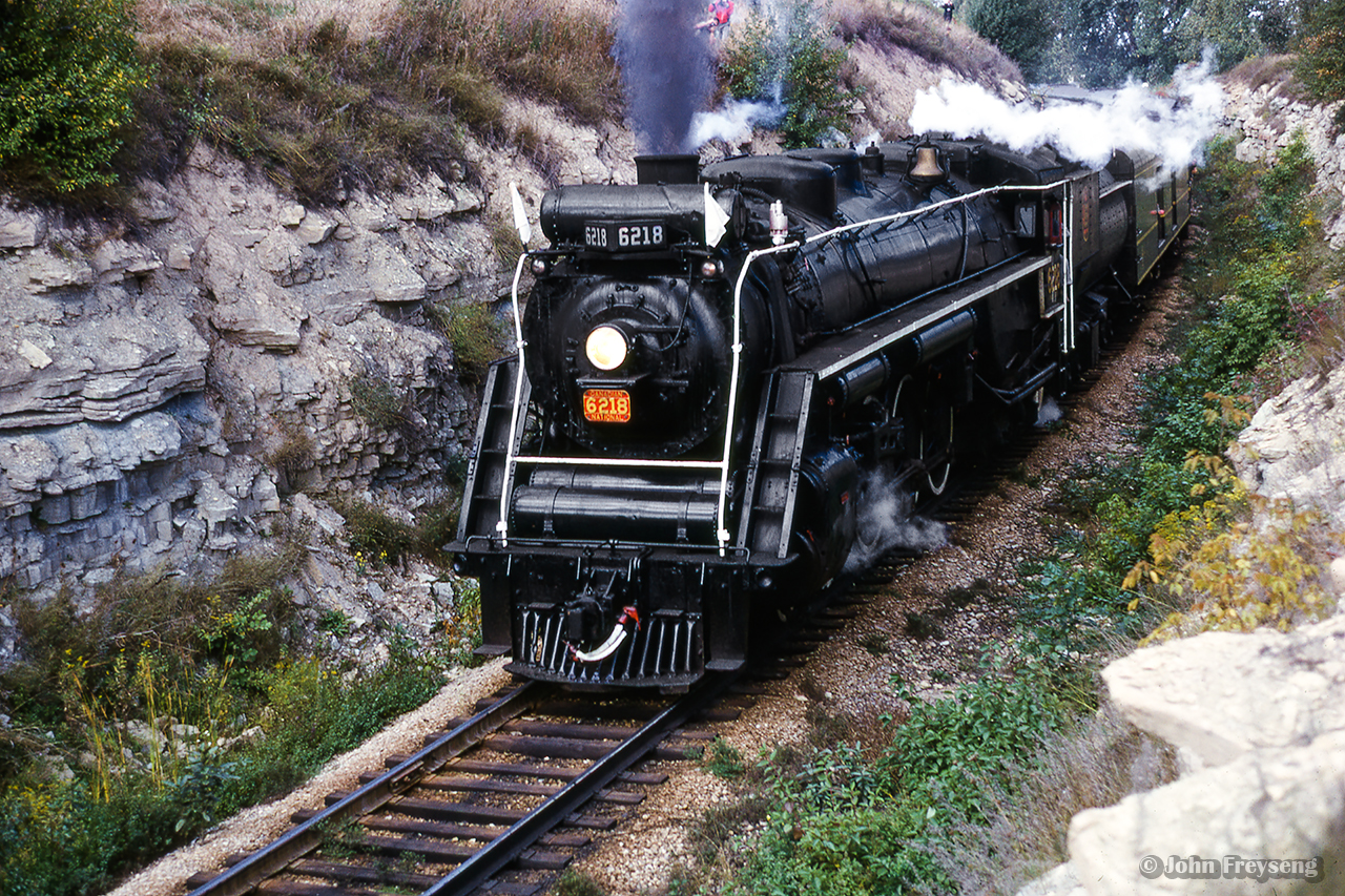 Storming up the hill from Merritton, CNR 6218 leads a Toronto to Niagara Falls excursion into Thorold through a long rock cut.  This Upper Canada Railway Society trip was operated Toronto - Burlington - Stoney Creek - Merritton - Thorold - Welland Jct. - Niagara Falls.

Scan and editing by Jacob Patterson.