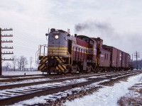 CPR 6515 works west along the Galt sub with a Lambton - Guelph Junction wayfreight, having just crossed Winston Churchill Blvd in Lisgar.

<br><br><i>Scan and editing by Jacob Patterson.</i>