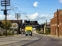 Working local industries along the Newmarket Sub, CN 8174 rumbles north over Rogers Road.  This scene has changed quite a bit, with the CNR bridge lettering now replaced with Metrolinx insignia, and most industries removed.  The site at left is now home to a school, while housing has sprung up on the former Brooks Mfg Ltd site at right.  Gone too is the <a href=https://www.railpictures.ca/?attachment_id=35859>Rogers Road streetcar line,</a> which last ran just two years after this photo in July 1974.  Further information <a href=https://spacing.ca/toronto/2014/07/19/remembering-rogers-road-streetcar/>found HERE.</a>

<br><br><i>Scan and editing by Jacob Patterson</i>