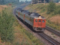 <br>
<br>
 At track speed: VIA CN #655,  daily except Saturday, with RDC-3 / RDC-9 / RDC-1 combo,
<br>
<br>
The view from the Bee Bridge, CN Newtonville crossovers in the background. September 3, 1978 Kodachrome by S.Danko
<br>
<br>
  interesting: 
<br>
<br>
 #655 (late afternoon) and #652 (noon hour)  were un-named fast Budd Car runs, Kingston – Union 158 miles in 2:45, with five intermediate stops,   The' Ontarian' Budd Car trains #651 (early am) & # 656 (evening).
<br>
<br>
and for the Siemens Venture fans: note the Budd Cars 12 light weight axles, at track speed: 90 mph, on jointed rail.
<br>
<br>
RDC-3 weight 231,000 pounds, with 51% weight on two driving axles; Siemens Venture car weight 112,000 pounds each plus Siemens Charger loco weight: 260,000 pounds.
<br>
<br>
Three RDC 's weight approximately 686,000 pounds on 12 axles ; VIA Venture five car  train weight approx 820,000 pounds on  24 axles.
<br>
<br>
More:
<br>
<br>
     <a href="http://www.railpictures.ca/?attachment_id=  47314 ">  VIA #652  </a>
<br>
<br>
sdfourty