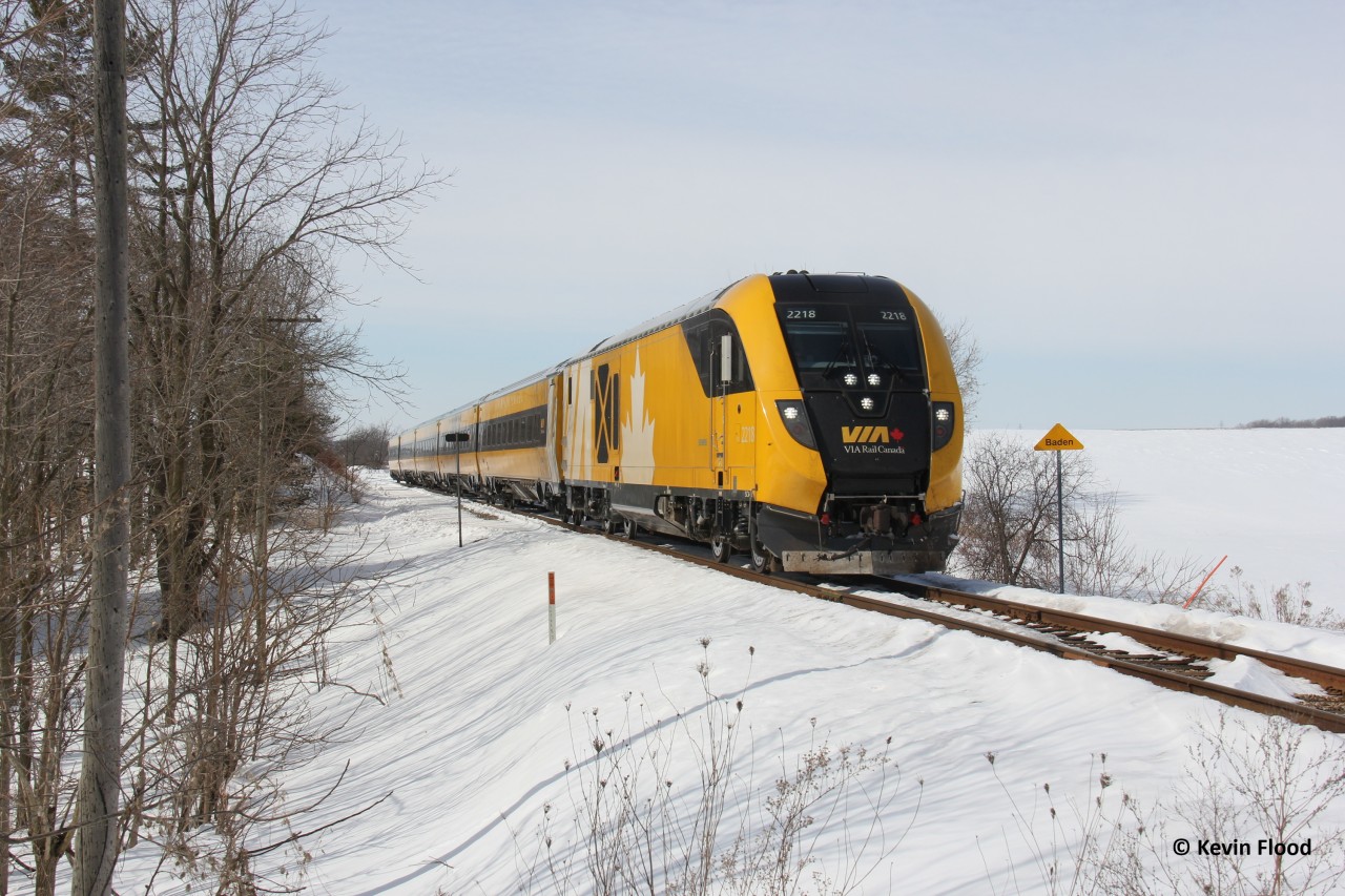 On a nice winter day, VIA 84 with the one and only Lumi-scheme Charger set heads east out of Baden towards its next station stop at Kitchener.