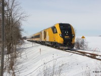 On a nice winter day, VIA 84 with the one and only Lumi-scheme Charger set heads east out of Baden towards its next station stop at Kitchener.