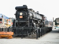 <b> Fire breathing monster </b> <br>
CN 6015 is looking good as always sitting on its perch at the Jasper, AB station on this cold, windy, and overcast March morning. <br>
Behind me and the store fronts at left there is terrible forest fire damage from last summer, but CN 6015 and the surrounding railway buildings managed to come through the devastation completely unscathed.