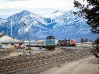 <b> Crisp and cold morning </b> <br>
While VIA 001 The Canadian is getting a full service and head end crew change at Jasper, AB I had plenty of time to walk around town for some pics. <br>
Standing at the west end entrance to CN's yard and Operation Centre at Hazel Avenue I snapped VIA 001 and a CN westbound grain train waiting to depart. <br>
It was a frosty cold and windy morning but well worth the walkabout. <br>
There was plenty of construction activity visible as the town is well underway to rebuilding.