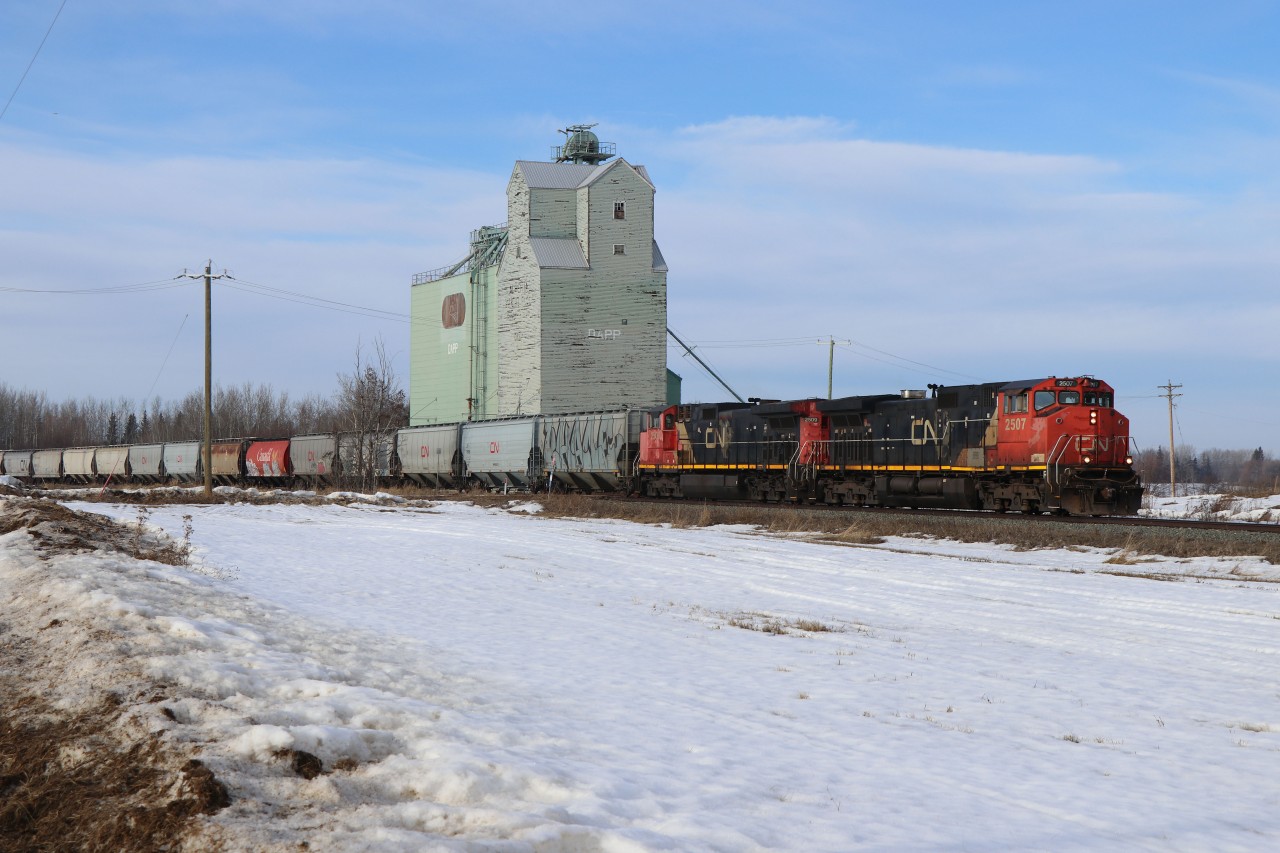 On the ground, where NAR GP9s once trod...G 84851 03 heads south to Edmonton's Walker Yard behind a pair of CN Dash 9-44-9CWLs. Although mostly grain, this train also had lumber and other merchandise traffic. 

For an aerial view, see Rob Eull's photo
https://www.railpictures.ca/?attachment_id=56174

"From the land of the mighty Peace..."