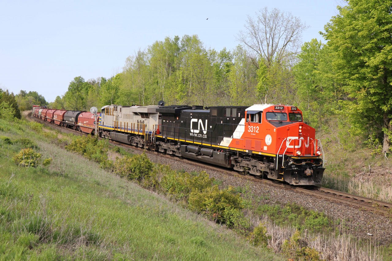 On the return trip, CN 570 (Aldershot-MacMillan Yard turn) makes good time heading downhill past mile 30 on the Halton sub. Power is recently rebuilt AC44C6M 3312 (originally 2615) and ES44AC 2777 (formerly CREX 1337, acquired by CN in 2022).