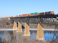 Approaching Bretville Jct, A 44251 crosses the North Saskatchewan river before turning south and heading for Calgary. 67 cars (intermodal up front and merchandise on the tail end) behind SD75ACC 8301(rebuilt from 5684) and IC 2707. The chase is on!