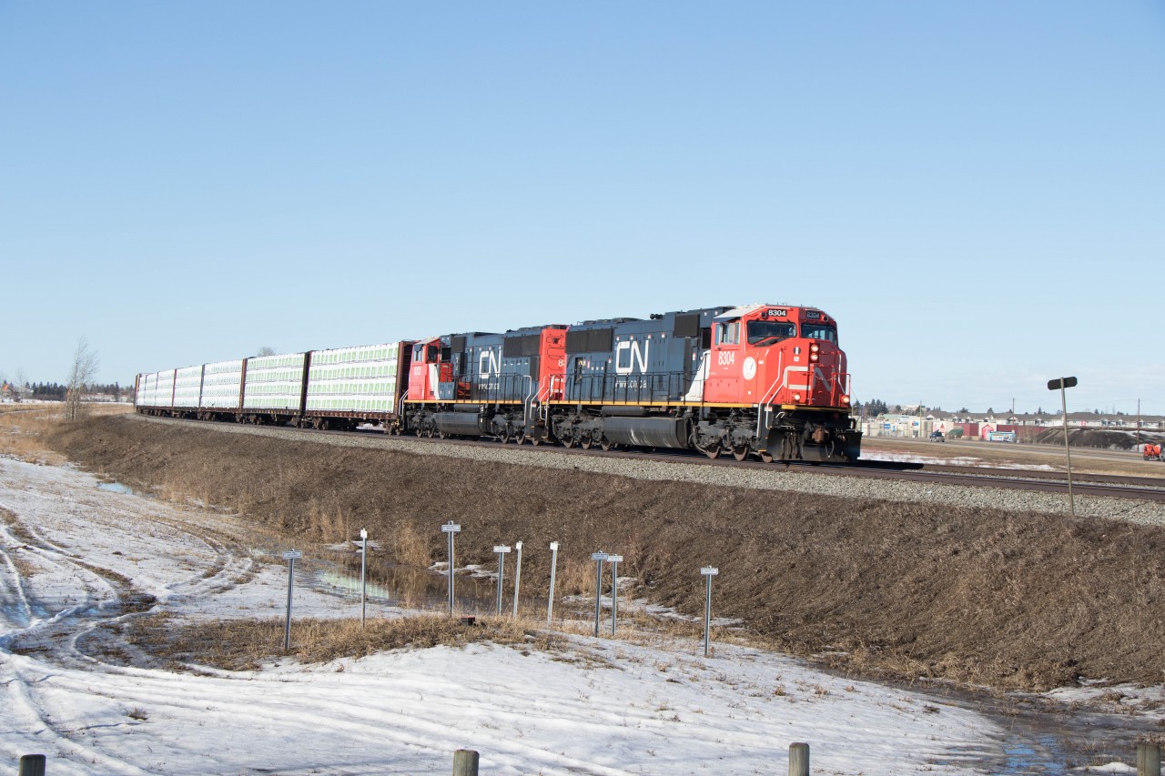 Daily Prince George to Symington (Winnipeg) train 34851 rounds the curve just east of Spruce Grove behind newly rebuilt SD75IACCs 8304 and 8302 (formerly 5727 and 5689).