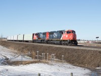 Daily Prince George to Symington (Winnipeg) train 34851 rounds the curve just east of Spruce Grove behind newly rebuilt SD75IACCs 8304 and 8302 (formerly 5727 and 5689).