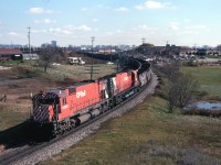 CP 4729 about to duck under the CN Halton sun in North Toronto