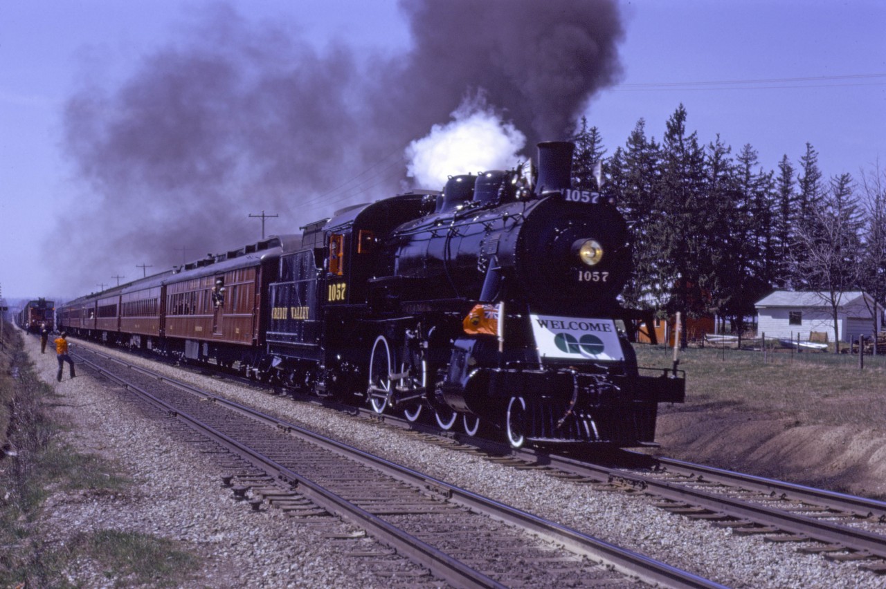 Credit Valley 4-6-0 1057 (Ontario Rail Association) approaches the Winston Churchill crossing east of Georgetown on a special run to Toronto Union Station, celebrating the commencement of GO Transit service to Georgetown in April 1974. This special run was made on the Saturday prior to opening and the first revenue GO trains ran on Monday 29 April 1974.