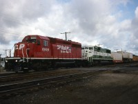 CP southbound with dual flags new paint leading at Cartier station trailing one of 3 BN units that CP borrowed to test out.