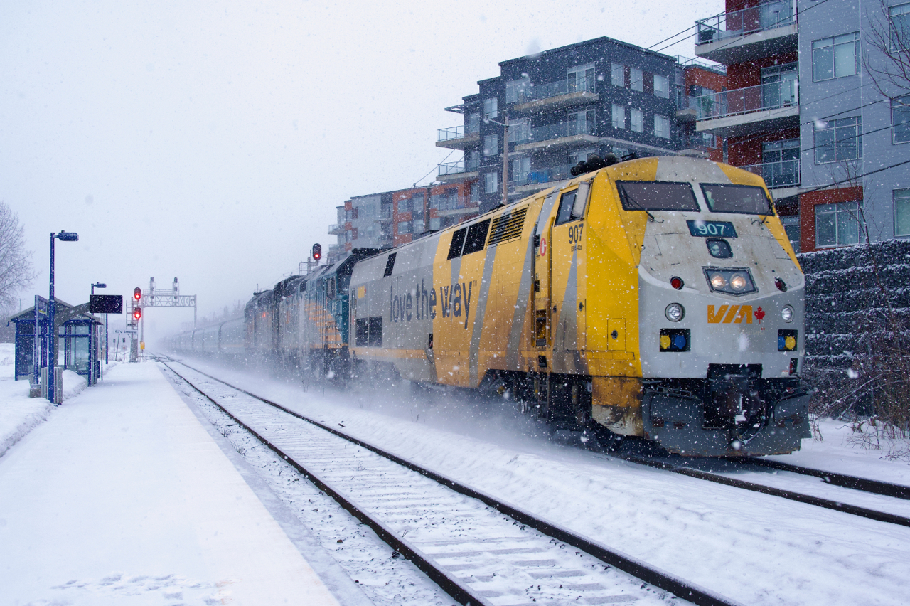 About to arrive at Saint-Lambert Station nearly a full twenty-four hours late, VIA 15 has rescue power VIA 907 leading. After having engine issues and then becoming snowbound at Rimouski, CN sent rescue power to take the train from there to Sainte-Foy, where VIA 907 replaced the two CN units. I believe this is the first time a GE runs on VIA 14/15.