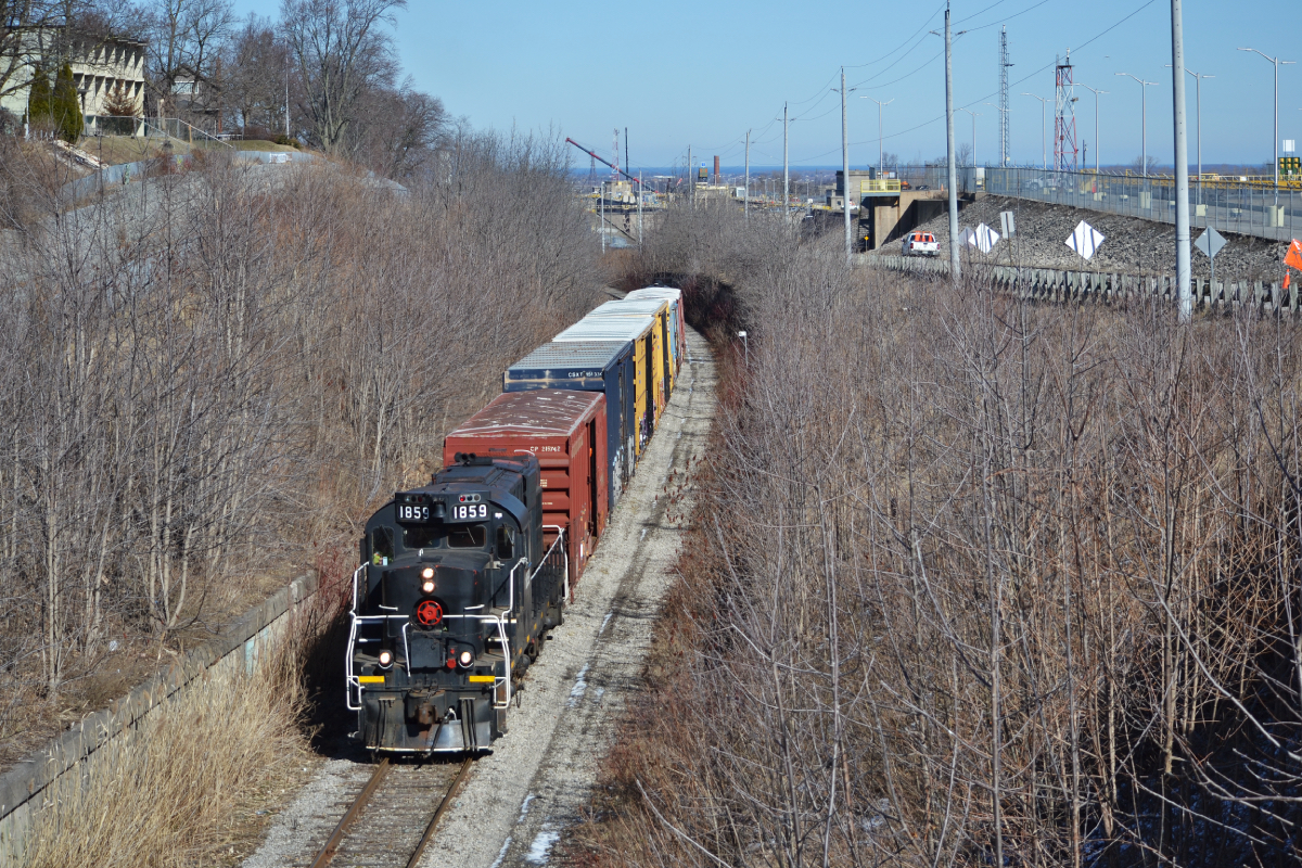 Well, that's it. As plain and unassuming as the black paint on the former CP RS-18u, TRY 1859 heads up the Canal Sub one last time before the line would be mothballed to its current state. As far as I am aware, this was the last train to pass over this segment between Merritton and Thorold. The track between Welland to Thorold is still in service as tank cars are still being stored behind Poly.