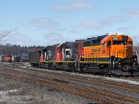 The 0600 Hamilton Yard Job is seen departing Stuart with two scrap gondolas for Triple M. They have the BNSF 2968 leading, this was the jobs second run out of the yard that morning. Photo taken from the West Harbour GO platform.