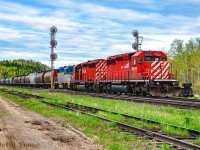 The greens are still fresh, bright green and its only the start of June in northwestern Ontario. Spring is still springing as grain empties work Kaministiquia- 23 miles west of Thunder Bay- lifting stored empties out of the south storage track with CP 5959- CP 5971- DH 7303. 