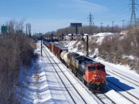 CN 324 is exiting Taschereau Yard with CN 3099 & CN 2772 for power. It is heading to St. Albans to interchange with the New England Central Railroad.