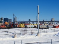 CN 149 is passing Pointe St-Charles yard on a frigid morning with CN 3817 & CN 3286 for power. At far right is the Pointe St-Charles' caboose, it will be shoving westwards once CN 149 clears.